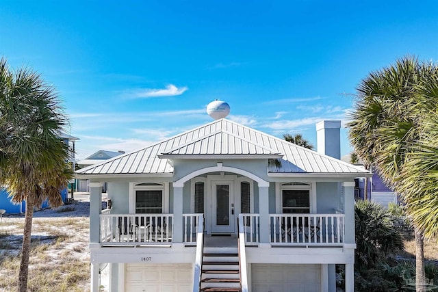 view of front facade featuring a porch and a garage