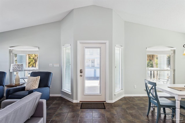 entrance foyer featuring a wealth of natural light and lofted ceiling