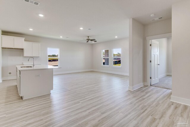 9797 Windyhill Rd, Pensacola, FL 32526 - kitchen with a sink, plenty of natural light, ceiling fan, white cabinets, and recessed lighting