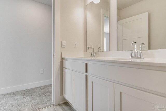 9797 Windyhill Rd, Pensacola, FL 32526 - bathroom featuring double vanity and baseboards