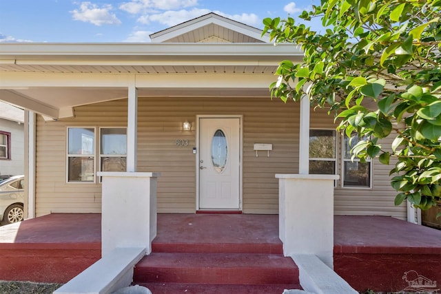 doorway to property with a porch