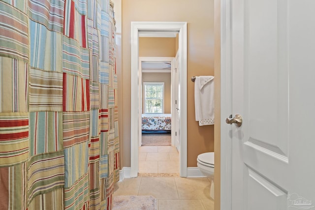 bathroom featuring toilet and tile patterned floors