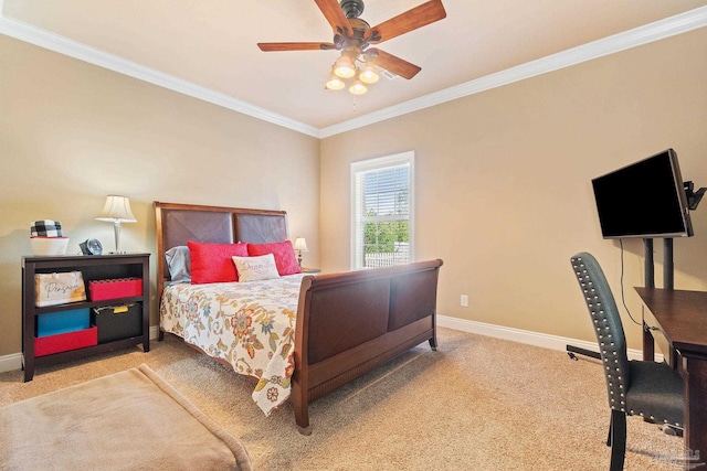 carpeted bedroom with ceiling fan and ornamental molding