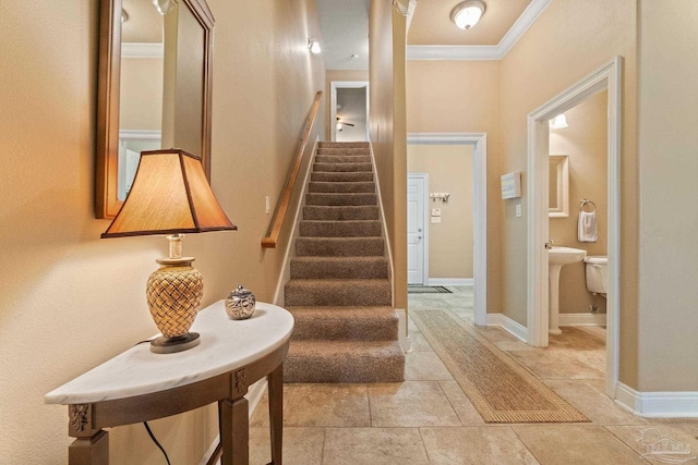 staircase featuring crown molding