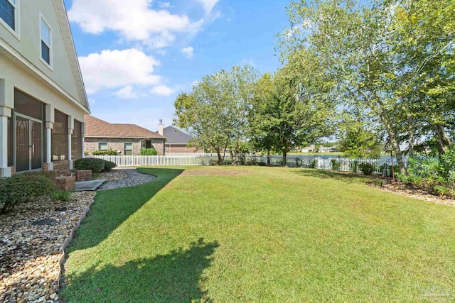 view of yard with a sunroom and a patio area