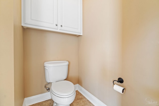 bathroom featuring tile patterned flooring and toilet