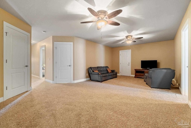 interior space with ceiling fan and carpet flooring