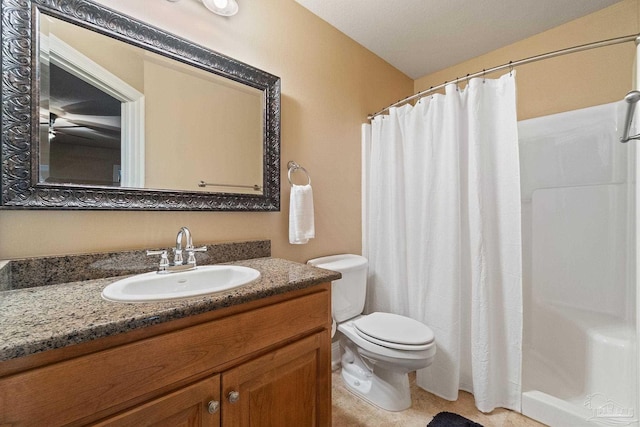 bathroom featuring a textured ceiling, walk in shower, vanity, and toilet