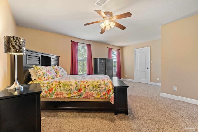 bedroom featuring light carpet and ceiling fan