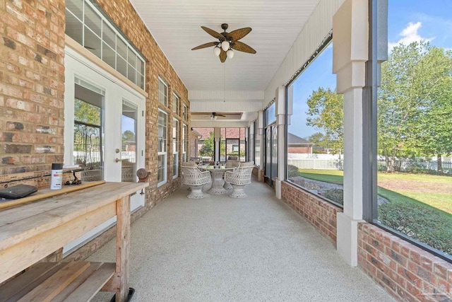 sunroom featuring ceiling fan