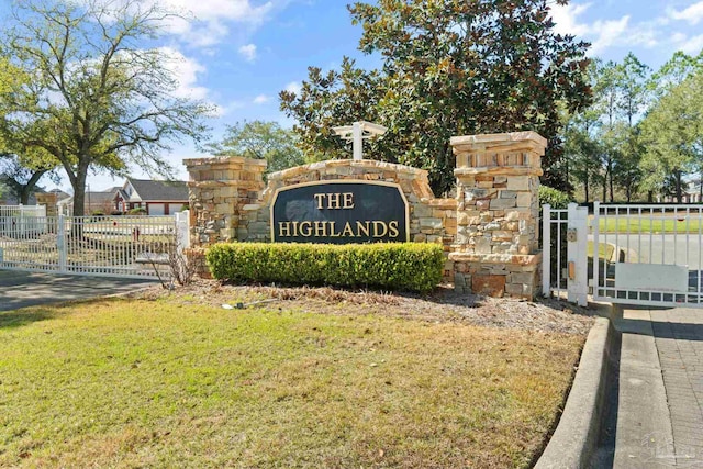 community / neighborhood sign with a lawn