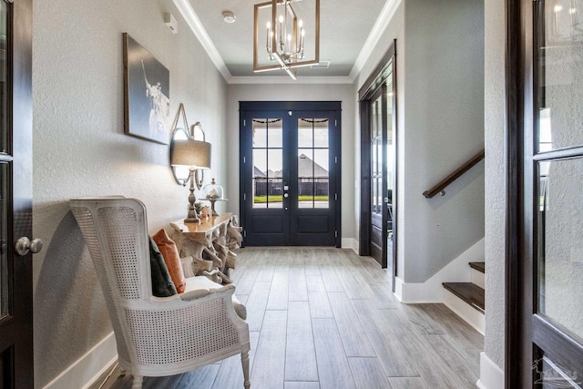 2420 Meeting St, Cantonment, FL 32533 - foyer featuring crown molding, a chandelier, wood finished floors, stairs, and french doors