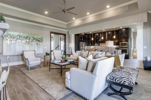 2420 Meeting St, Cantonment, FL 32533 - living room featuring crown molding, ceiling fan, and light wood-type flooring