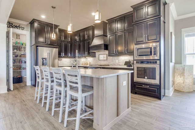 2420 Meeting St, Cantonment, FL 32533 - kitchen featuring custom exhaust hood, light countertops, decorative backsplash, and stainless steel appliances