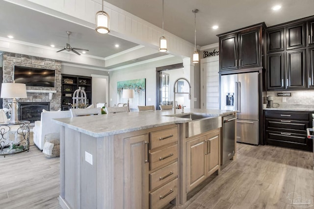 2420 Meeting St, Cantonment, FL 32533 - kitchen featuring ceiling fan, ornamental molding, a sink, stainless steel appliances, and open floor plan