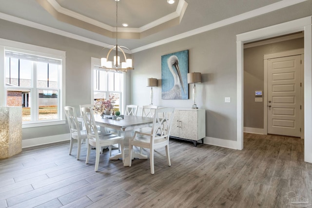 2420 Meeting St, Cantonment, FL 32533 - dining space featuring crown molding, a raised ceiling, a notable chandelier, and wood finished floors