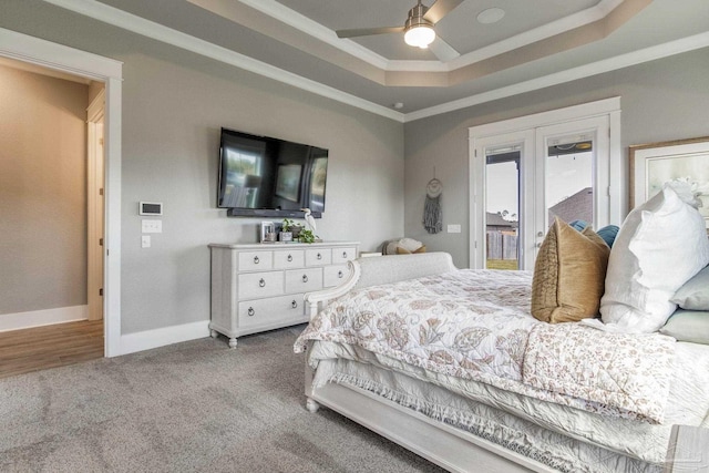 2420 Meeting St, Cantonment, FL 32533 - carpeted bedroom with access to outside, ceiling fan, a tray ceiling, ornamental molding, and baseboards