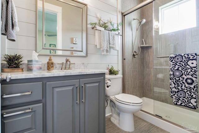2420 Meeting St, Cantonment, FL 32533 - full bathroom featuring toilet, vanity, and a stall shower
