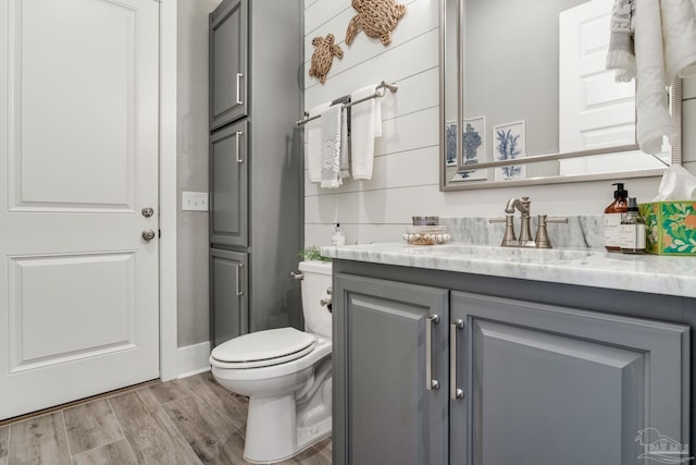 2420 Meeting St, Cantonment, FL 32533 - bathroom featuring toilet, vanity, and wood finished floors
