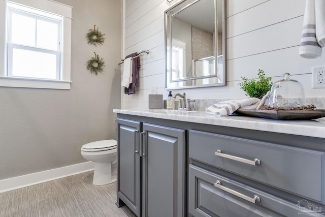 2420 Meeting St, Cantonment, FL 32533 - bathroom with toilet, vanity, and baseboards