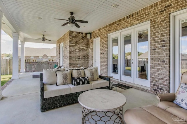 2420 Meeting St, Cantonment, FL 32533 - view of patio / terrace with fence, grilling area, a ceiling fan, an outdoor living space, and an outdoor kitchen