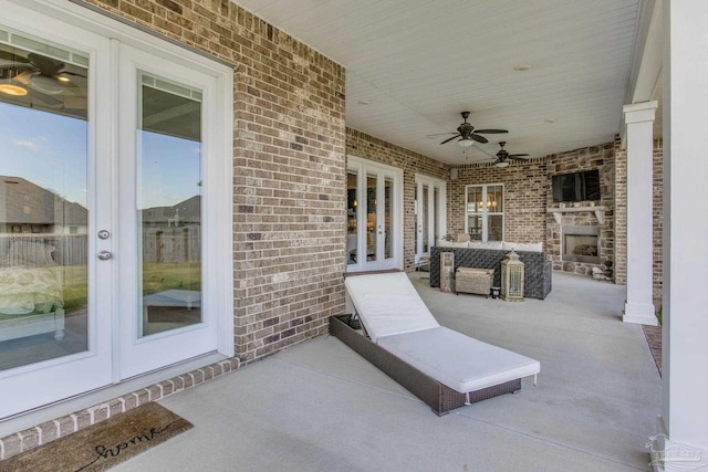 2420 Meeting St, Cantonment, FL 32533 - view of patio / terrace featuring french doors, ceiling fan, and an outdoor fireplace