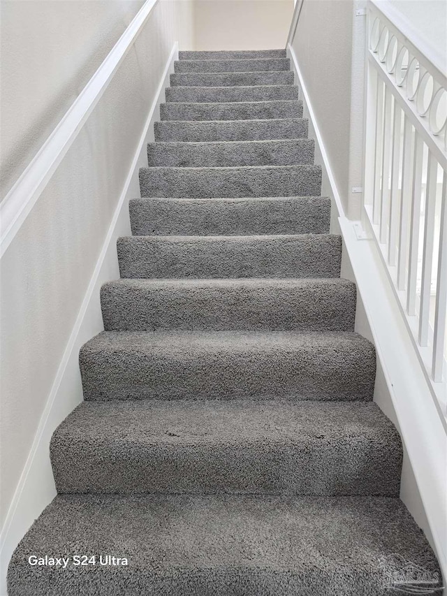 stairs with carpet floors