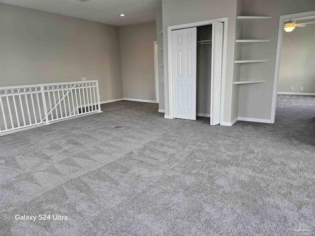 unfurnished bedroom with carpet floors and a closet