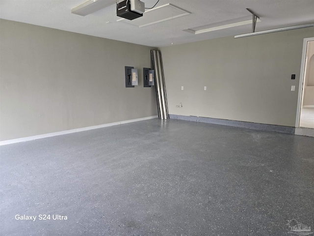 garage with electric panel and a garage door opener