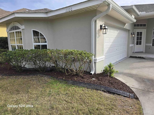 view of property exterior featuring a garage