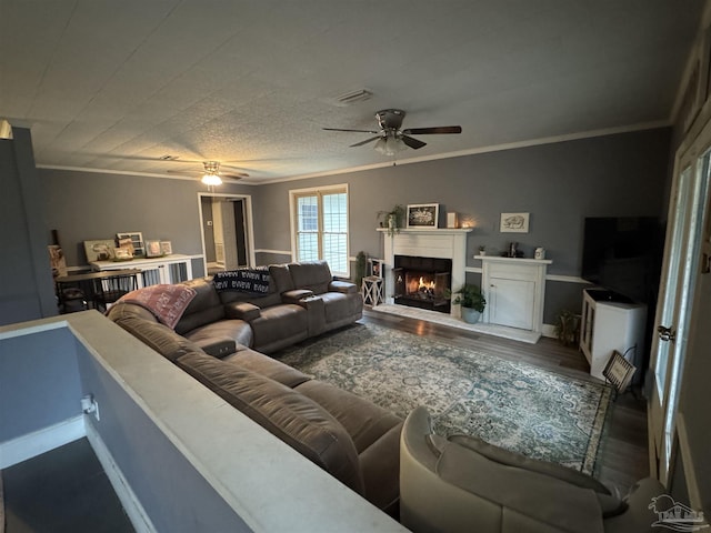 living room featuring ornamental molding, dark hardwood / wood-style floors, and ceiling fan