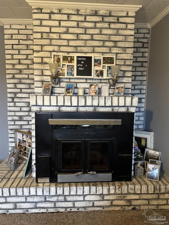 interior details featuring ornamental molding and a fireplace