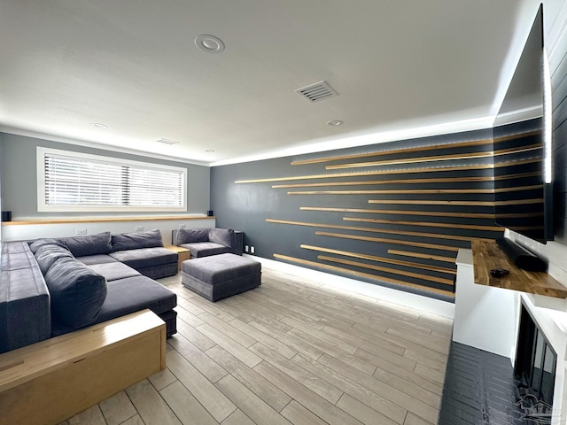living room featuring wood finished floors and visible vents