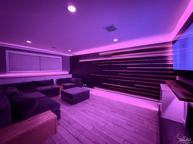 home theater room featuring recessed lighting, visible vents, and wood finished floors
