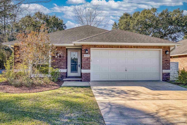 ranch-style house featuring an attached garage, a shingled roof, concrete driveway, a front lawn, and brick siding