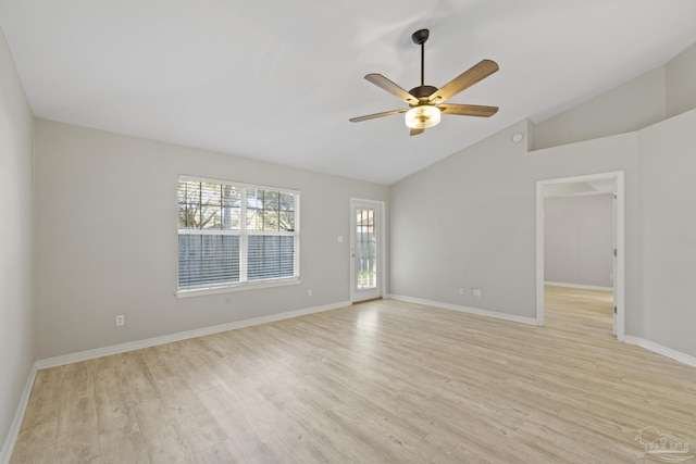 unfurnished room featuring light wood-type flooring, baseboards, a ceiling fan, and vaulted ceiling