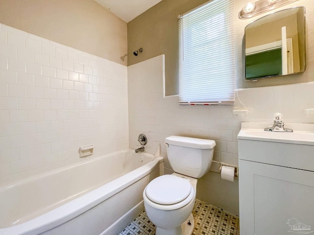 full bathroom with tile walls, shower / bath combination, toilet, wainscoting, and vanity