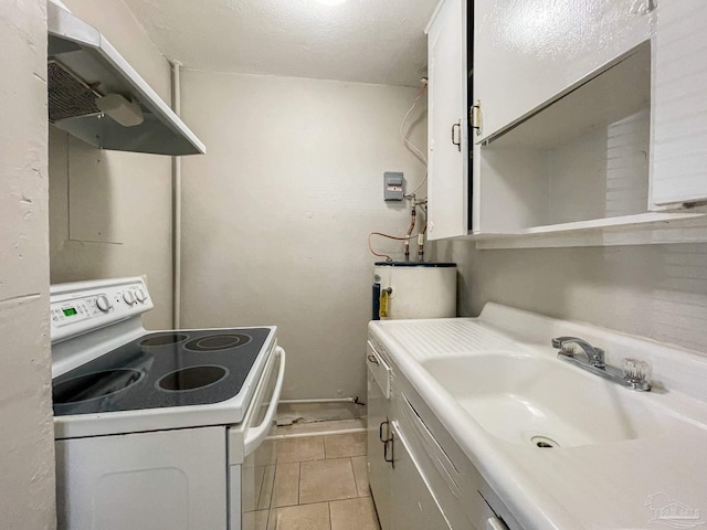 laundry room with water heater, a sink, and light tile patterned floors