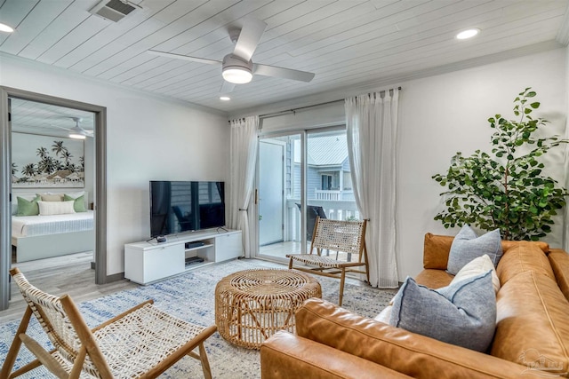 living room with light wood-type flooring, ceiling fan, crown molding, and wood ceiling