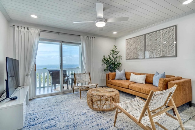 living room featuring ceiling fan, wood ceiling, a water view, and crown molding