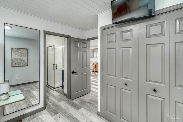 hall featuring wooden ceiling and light wood-type flooring