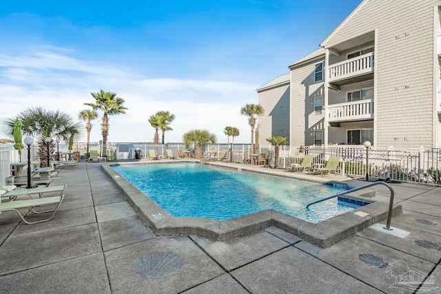 view of swimming pool with a patio