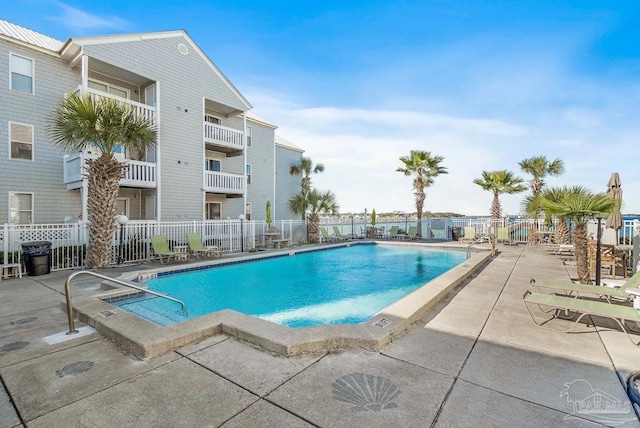 view of swimming pool featuring a patio area