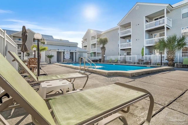 view of swimming pool with a patio