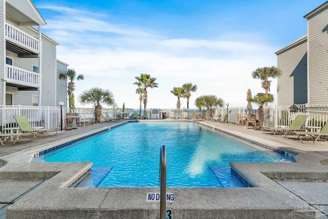 view of swimming pool with a patio area