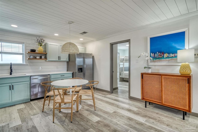 kitchen featuring stainless steel appliances, sink, decorative light fixtures, wood ceiling, and light wood-type flooring