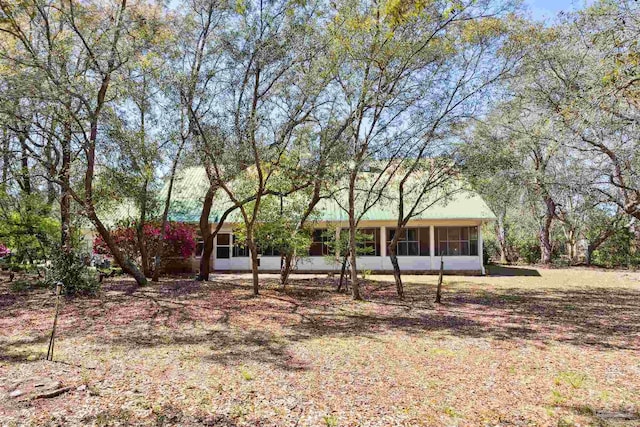 exterior space featuring a sunroom