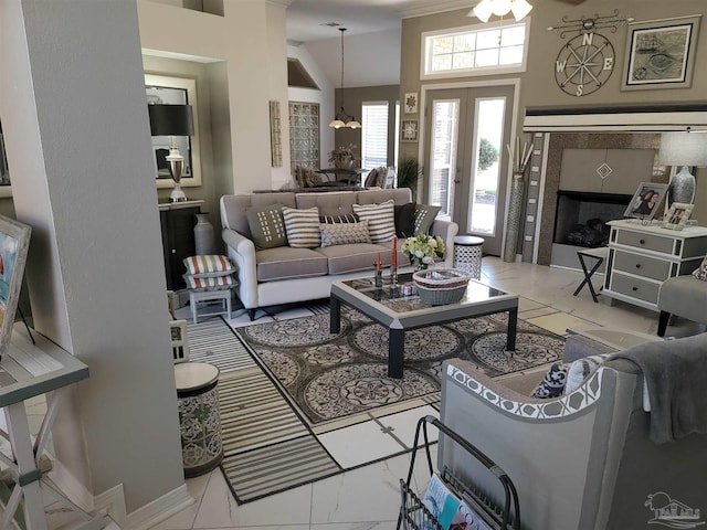 living area featuring marble finish floor and french doors