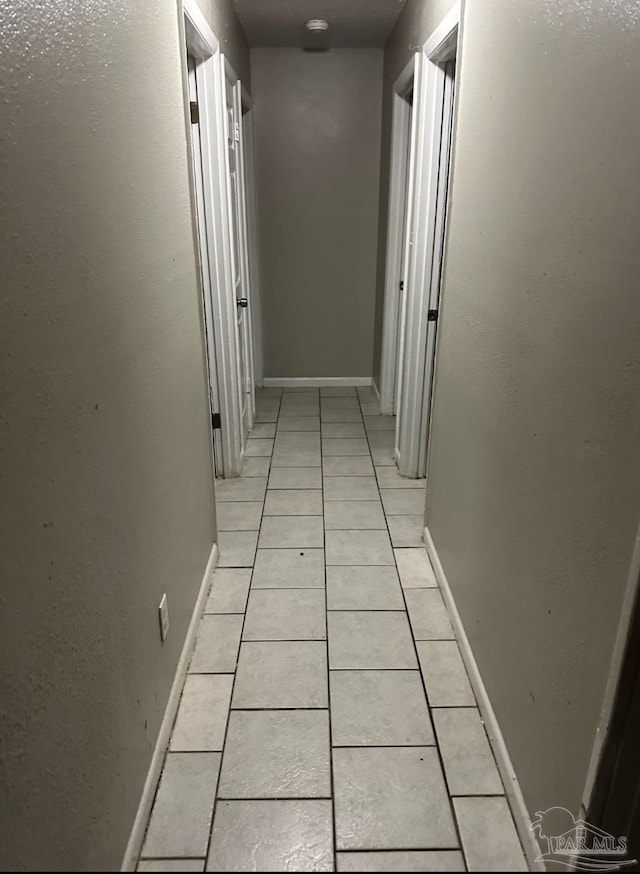 907 Colbert Ave, Pensacola, FL 32507 - hall featuring light tile patterned flooring