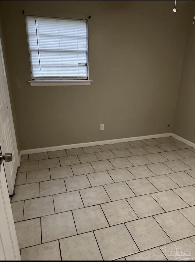 907 Colbert Ave, Pensacola, FL 32507 - spare room featuring baseboards and light tile patterned floors